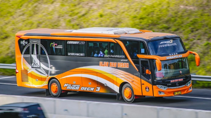 yellow and white bus on road during daytime
